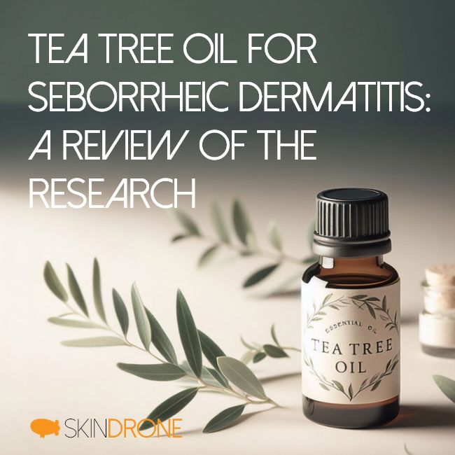 Tea Tree Oil for Seborrheic Dermatitis: A Review of the Research - Bottle of tea tree oil with yellow liquid and greenery on white surface