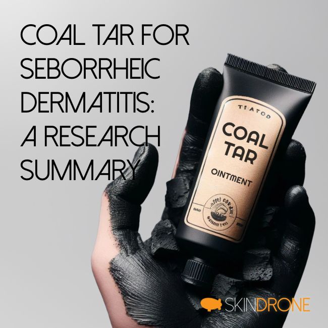 Small tube of coal tar ointment held in a hand cover in coal - to symbolize the use of coal tar for the treatment of seborrheic dermatitis